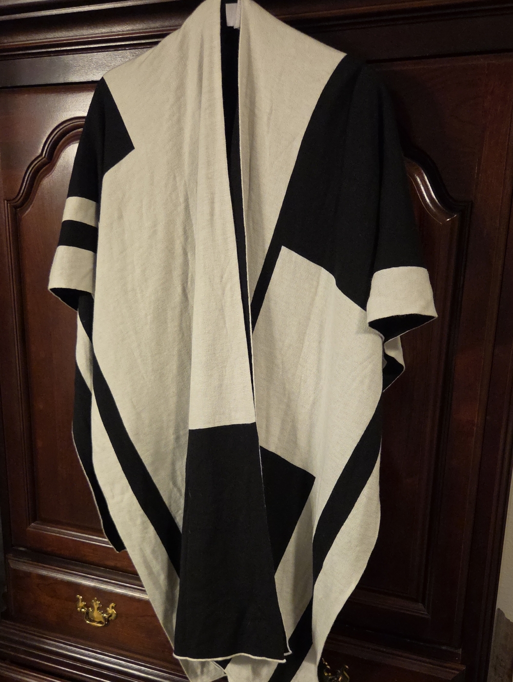 Chicos Reversible Colorblock Ruana adds unique detailing to a staple knit layer